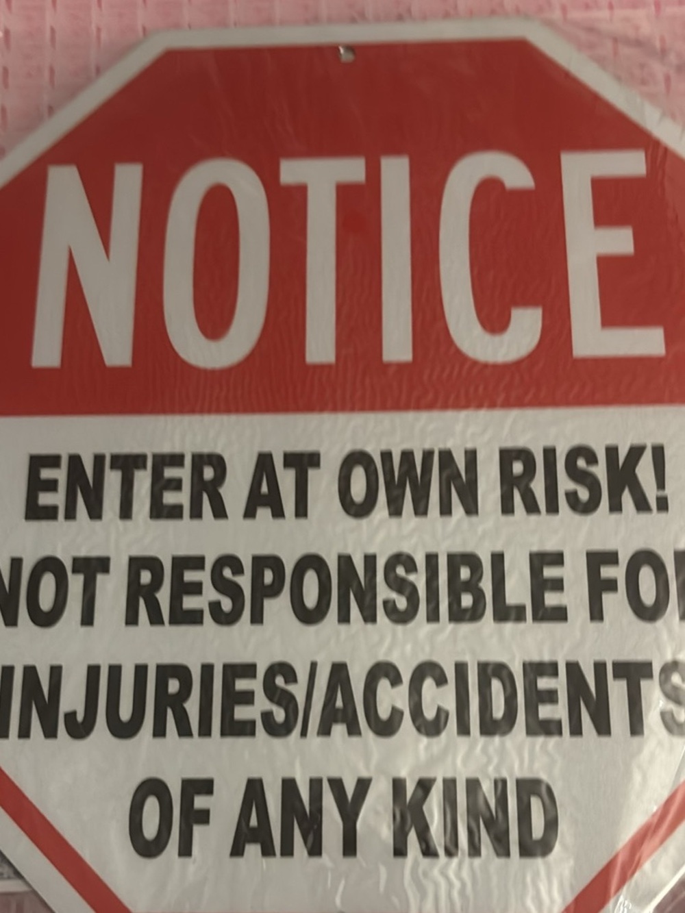 Two NOTICE Enter At Own Risk Sign - Red and White